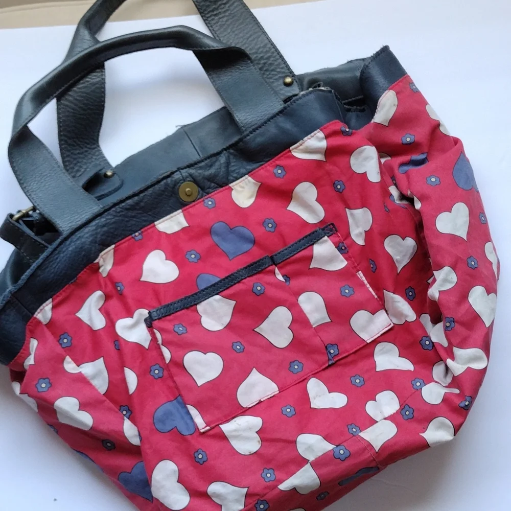 Anthropologie,Lucky Penny, leather purse with heart lining .